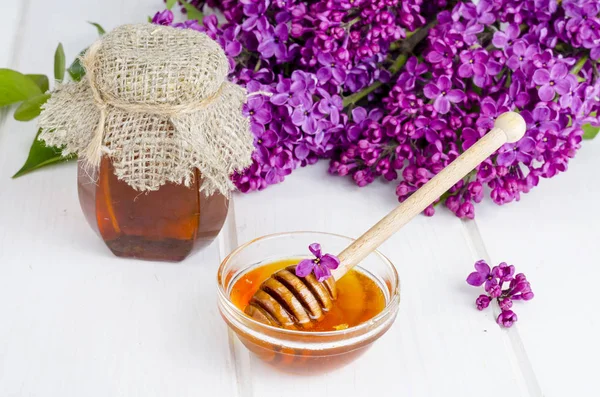 Summer fragrant lilac flower honey. Studio Photo