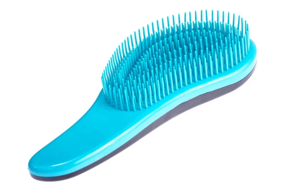 Синяя расческа для расчесывания волос домашних животных — стоковое фото
