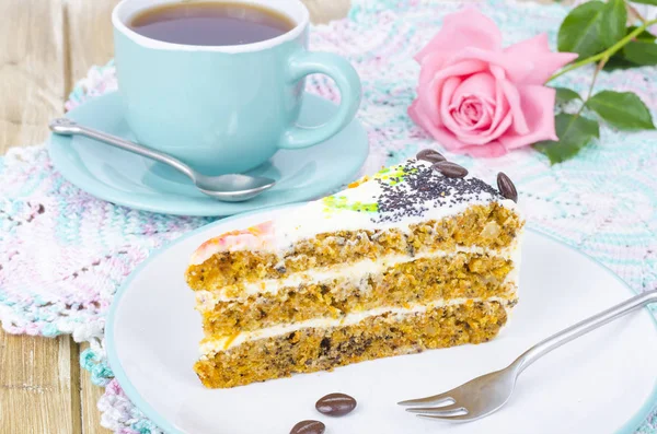 Slice of carrot sponge cake with cream