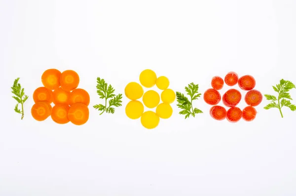 Pieces of colorful raw carrots on white background