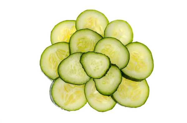 Small pile of sliced slices of fresh green cucumber isolated on white background. — Stock Photo, Image