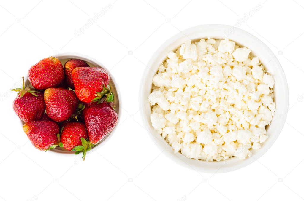 Healthy food. Fresh homemade cottage cheese and strawberries. Studio Photo