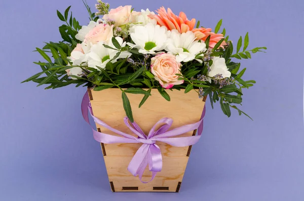 Flowers, bouquet in stylish wooden box. Studio Photo