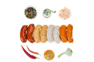 Grilled meat sausages with various spices and natural colors. Studio Photo clipart