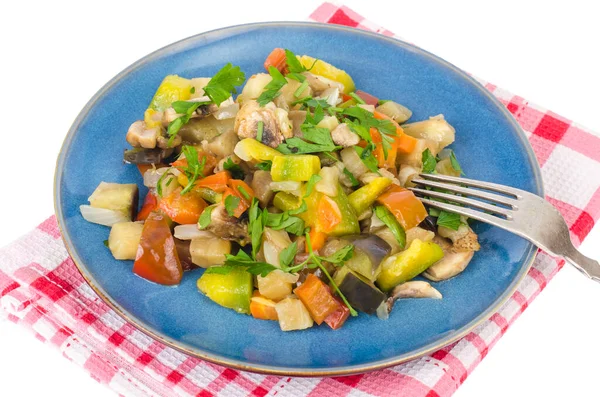 Bright vegetable stew of seasonal vegetables on plate on white background. Studio Photo