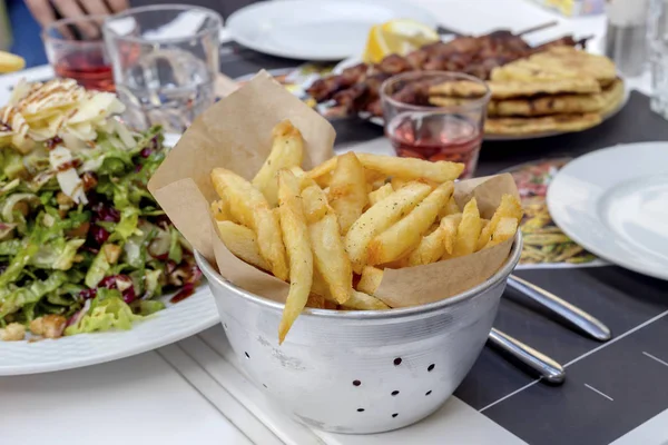 Dish with french fries in bowl close-up