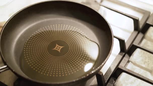 Pouring cooking oil on the frying pan. 4K — Stock Video