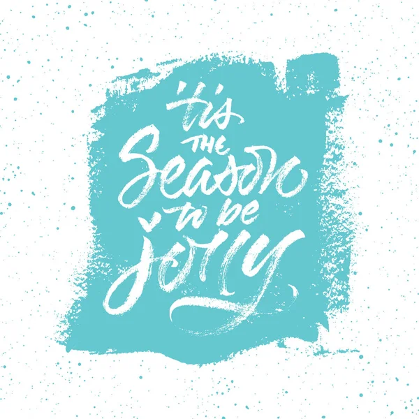 圣诞贺卡与报价 这是一个季节是乔莉 飞溅的蓝色背景上的手写画笔书法 — 图库矢量图片
