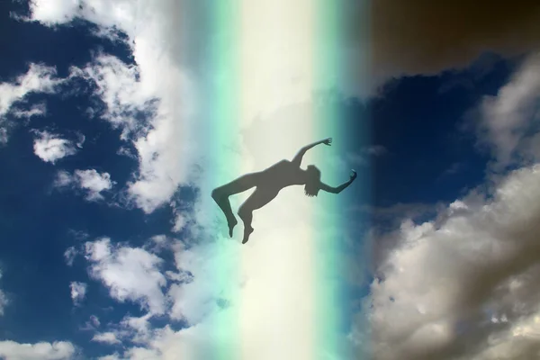 The dark silhouette of the soul of a deceased person ascends to heaven against a background of clouds. Afterlife, the concept of the immortality of the soul. 3D rendering