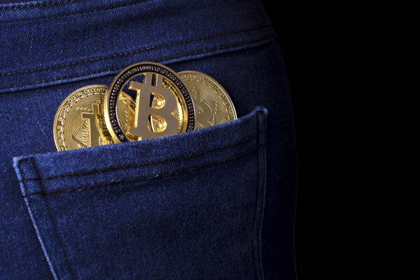 gold bitcoins in the back jeans pocket, background image with place for text