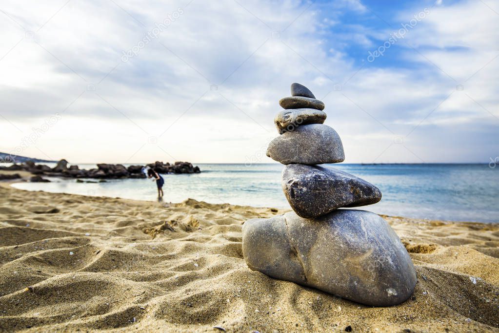 Stone cairn at the beach, concept of balance