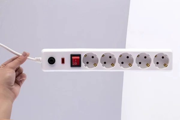 power extension cord with on-off switch in hand