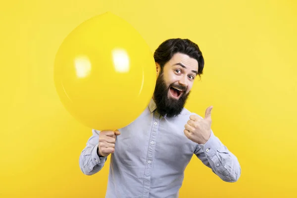 man with yellow balloon