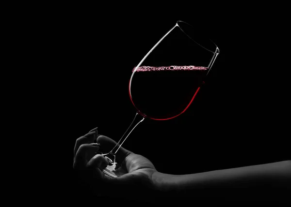 Red wine in hand — Stock Photo, Image