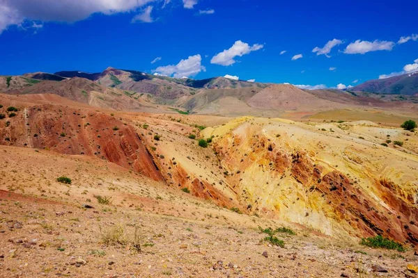 Landscape with red and yellow mountains. Mountains called Mars in Altai. Brown earth