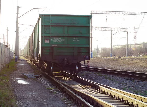 The last car of a departing train. Freight cars in a moving freight train. Transportation by rail. Russia. Krasnoyarsk. October 17, 2020