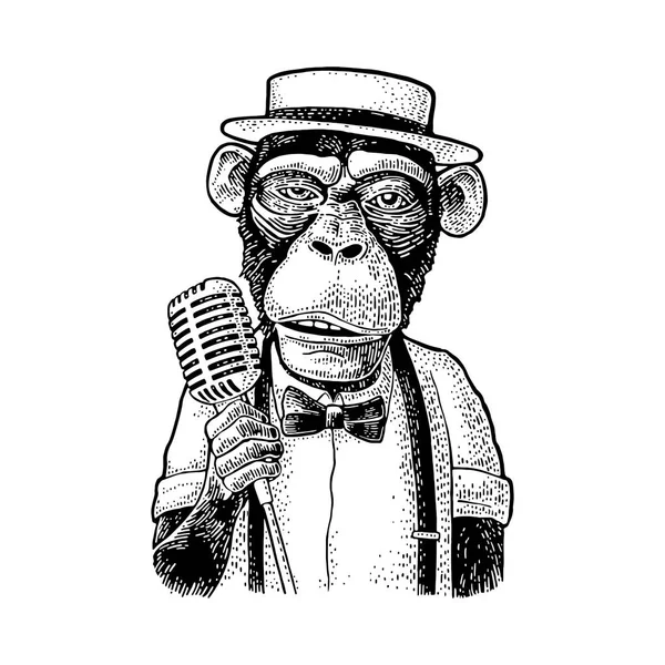 Opice na sobě klobouk, košile, motýlek, drží mikrofon. Gravírování — Stockový vektor