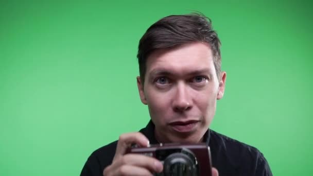 Mid Shot of a Handsome Photographer Taking Pictures. Background is Green Screen. — Stock Video