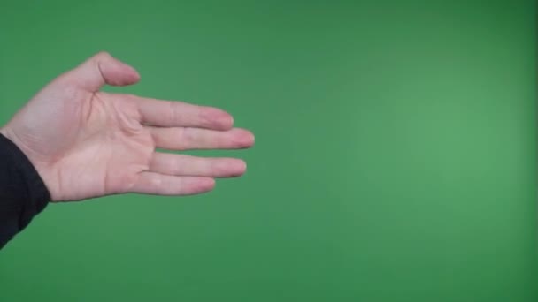 La sombra de la mano en la pared en el fondo de la pantalla verde — Vídeos de Stock