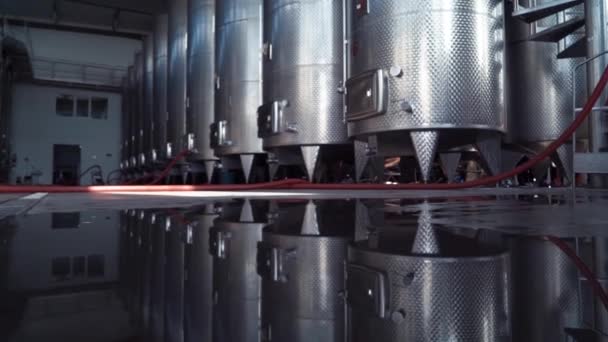 Large stainless steel wine distilling tanks. Silos for wine and beer fermentation . Steel barrels for fermentation of wine in winemaker factory . — Stock Video