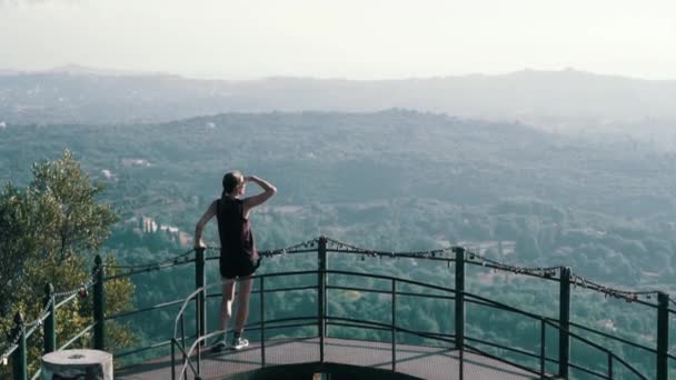 Hiker Woman enjoy the view Standing On Observation Deck Over City Creece Korfu — Stock Video