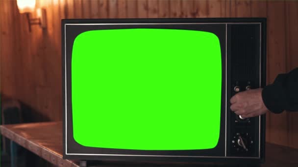 Retro televize se zelenou obrazovkou, přepínání kanálů