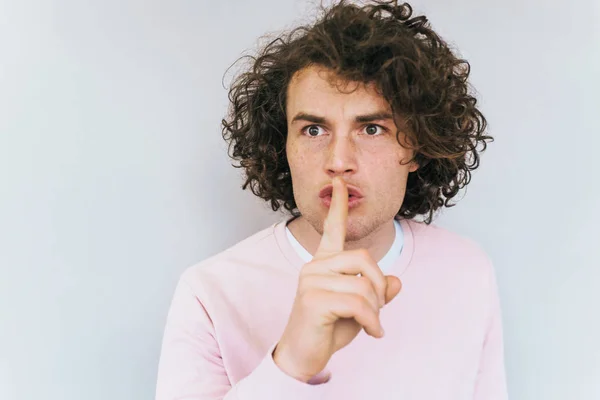 Portrait Serious Male Trendy Curly Hairdo Keeps Fore Finger Lips — Stock Photo, Image
