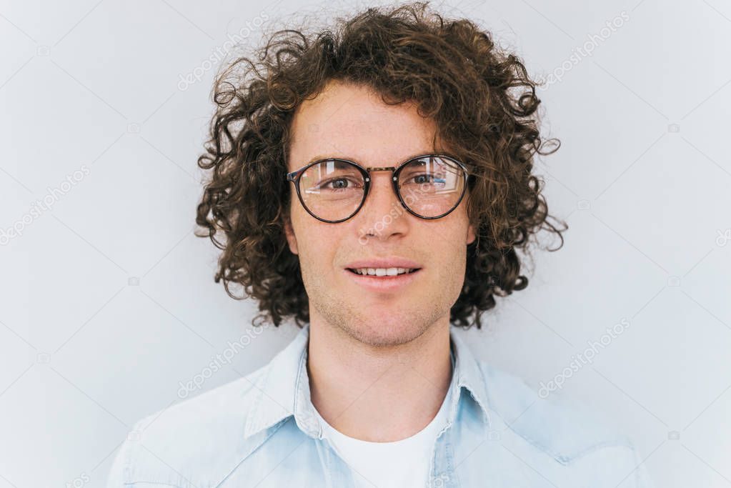 Closeup portrait of handsome freckled smart-looking smiling male posing for social advertisement, isolated on white background with copy space for your promotional information or content. People race