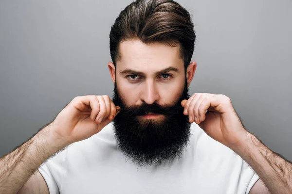 Horizontal Close Portrait Brutal Handsome Young Bearded Male Corrects His Stock Photo