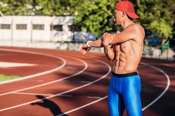 Young Athlete Male Stretching His Hand Track Stadium Preparing Running — Stock Photo, Image