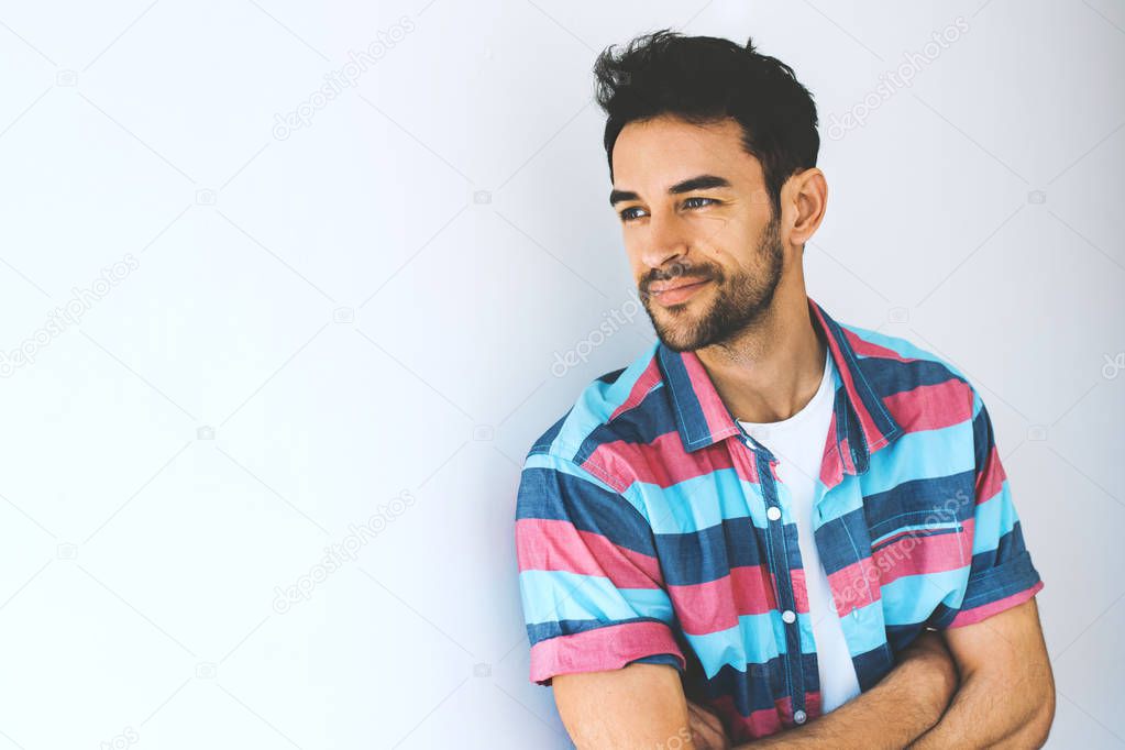 Positive portrait of handsome smart-looking smiling caucasian male model posing for social advertisement, isolated on white background with copy space for your promotional information or content.