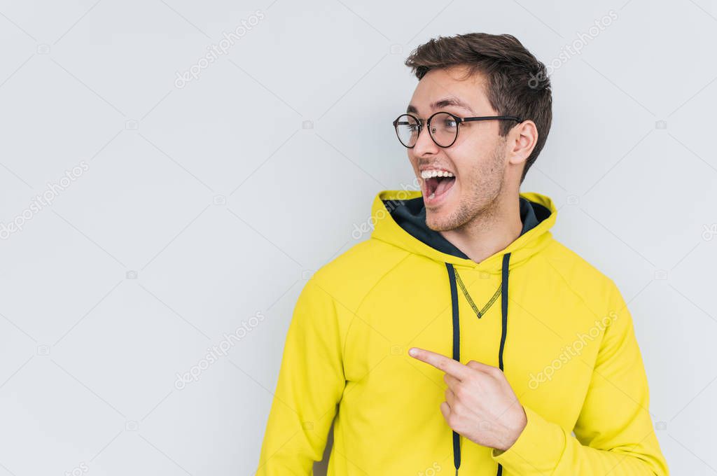 happy young male wearing trendy glasses isolated on white background