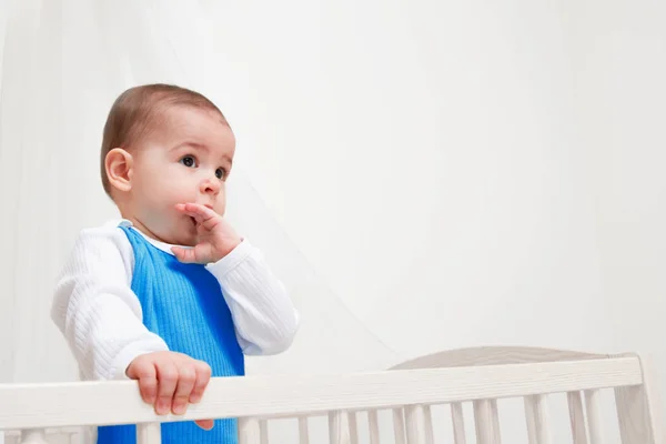 Cute Baby Bed White Background Look One Side Finger Mouth — Stock Photo, Image