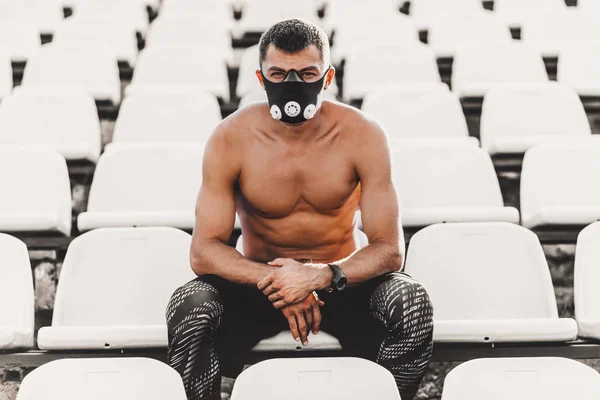 Young Muscular Male Sitting Seat Stadium Mask Outdoor Exercises Copy — Stock Photo, Image