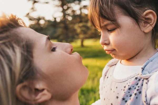 Close Cropped Portrait Happy Kid Girl Her Beautiful Mother Playing — Stock Photo, Image