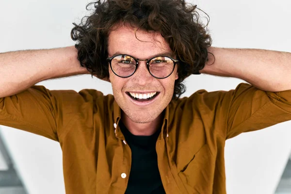 Laughing Handsome Man Curly Hair Wearing Glasses Posing Standing Grey — Stock Photo, Image