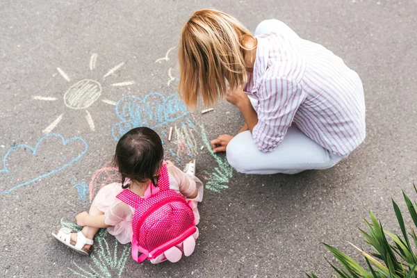 Top View Cute Little Girl Her Mother Drawing Colorful Chalks Лицензионные Стоковые Фото