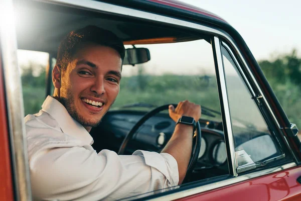 Rear View Handsome Happy Male Driver Smiling While Sitting Retro — Stock Photo, Image