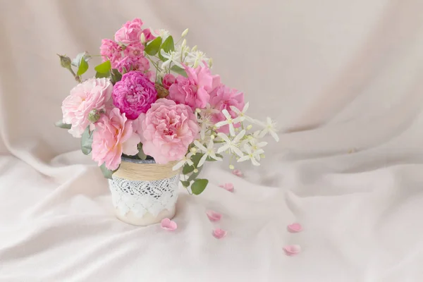 Beautiful rose in vase on white background.