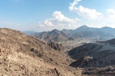 United Arab Emirates mountains view form Wadi Al Qor to Buraq Dam highest place around 800 meters clipart