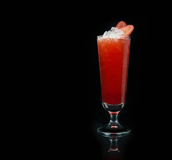 Strawberry cocktail with crushed ice on a black background — Stock Photo, Image