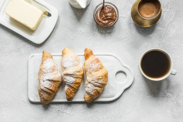 French breakfast with black coffee and croissant. Top view. Flat lay. — Stock Photo, Image