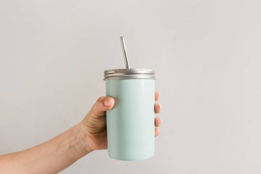 Reusable blue jar with metal straw for summer drinks. Individual use. Save the planet. Zero waste concept. No plastic. clipart
