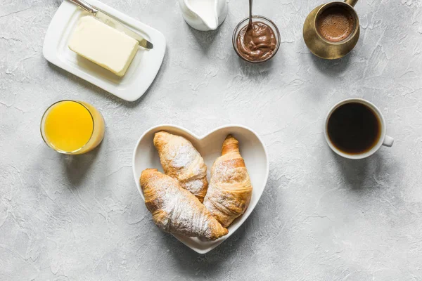 French breakfast with black coffee and croissant. Top view. Flat — Stock Photo, Image