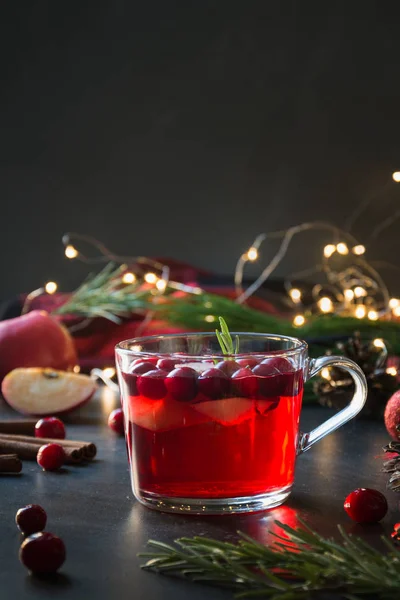 Christmas cranberry and apple mulled wine garnish rosemary and fir branches on black. Xmas drink. — Stock Photo, Image