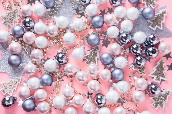 Christmas background with silver balls, stars, on pink . Top view. Xmas pattern. New Year. — Stock Photo, Image