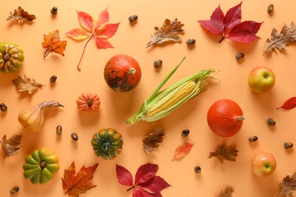 Pattern of fall harvest, pumpkins, apples, colorful autumn leaves on orange. Thanksgiving Day and Halloween. View from above. — Stock Photo, Image