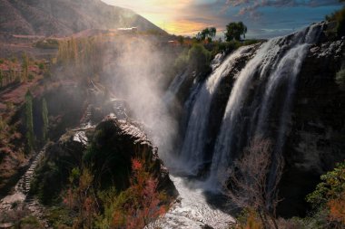 Landscape view of Tortum Waterfall in Tortum,Erzurum,Turkey. Explore the world's beauty and wildlife. clipart