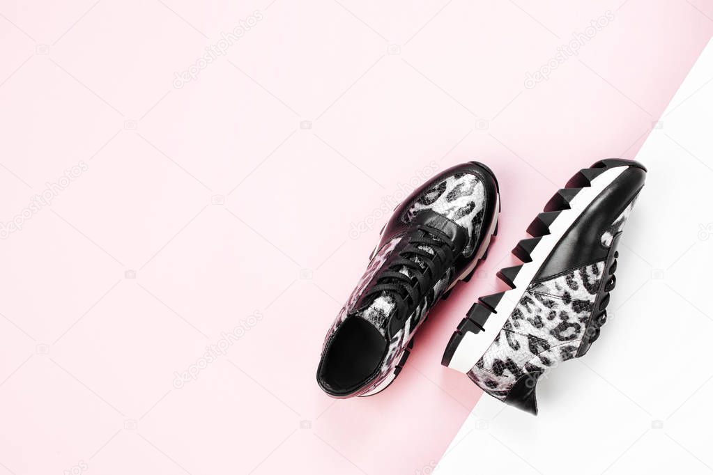 Stylish sneakers with animal pattern. Fashion design