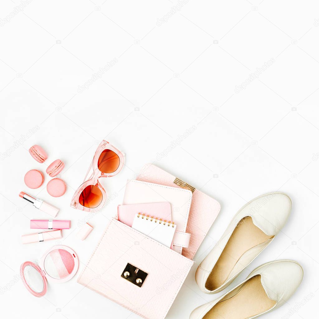 Cosmetic products, sunglass, shoes,  handbag on white background. Flat lay, top view. Fashion concept